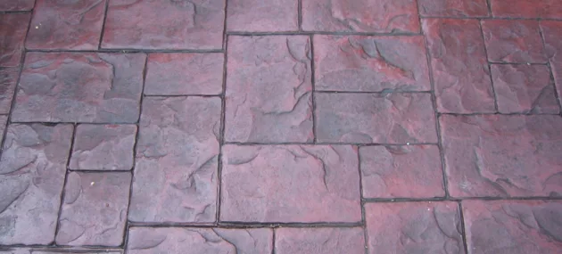 Pattern imprinted concrete surface by PICS, specializing in decorative concrete supplies.