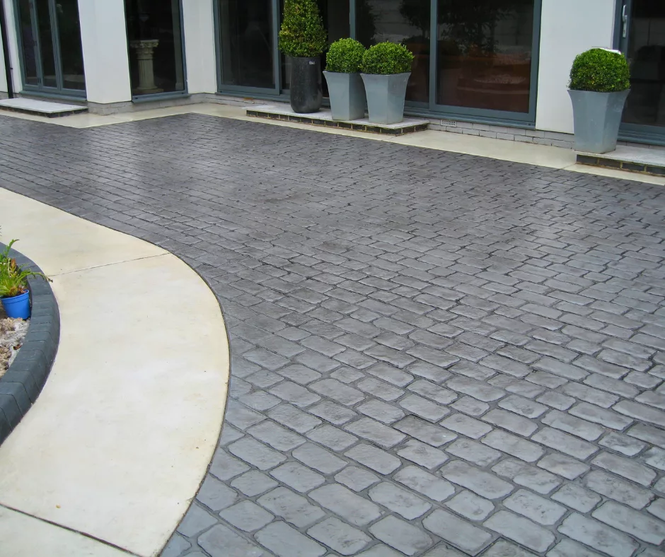 Pattern imprinted concrete driveway by PICS, showcasing elegant texture and design for modern homes.
