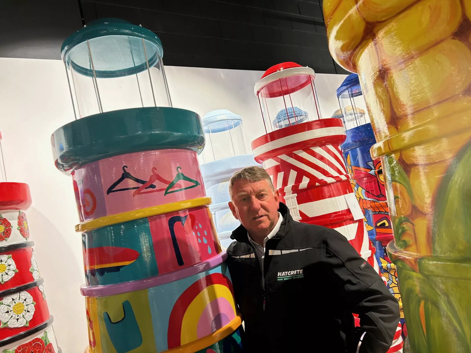 PICS expert with vibrant concrete pattern pillars, showcasing pattern imprinted concrete supplies.