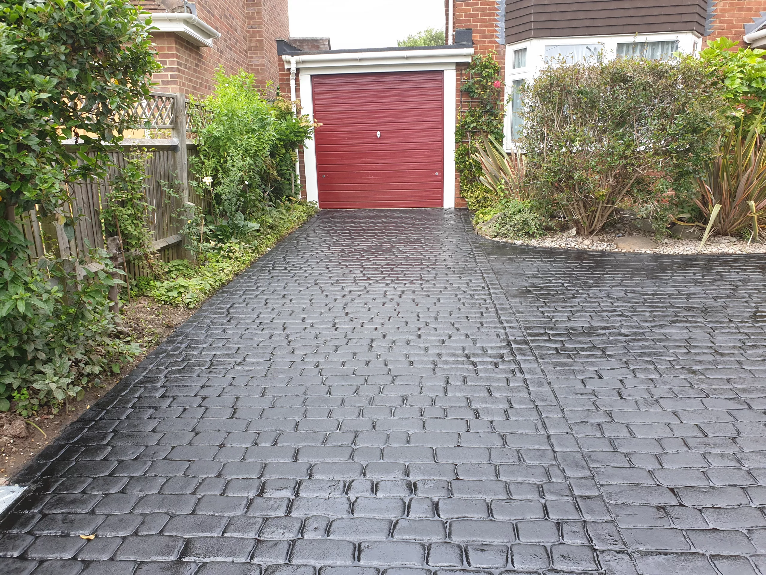 Pattern imprinted concrete driveway by PICS, leading supplier of decorative paving solutions.