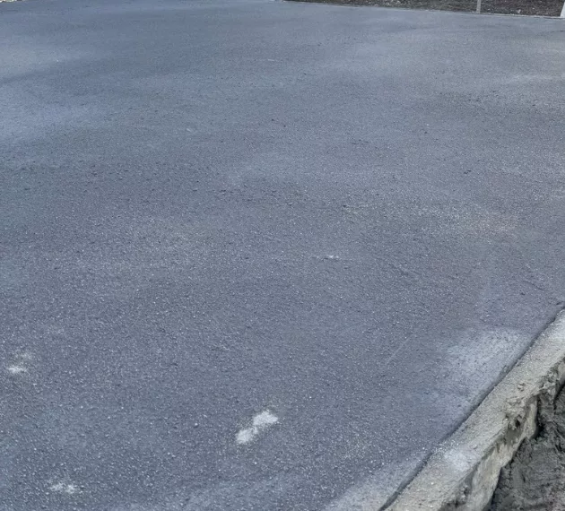 PICS pattern imprinted concrete driveway installation.